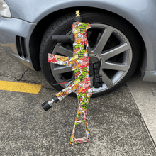 Load image into Gallery viewer, Pressure Washer Lance Rifle leaning against an audi wheel